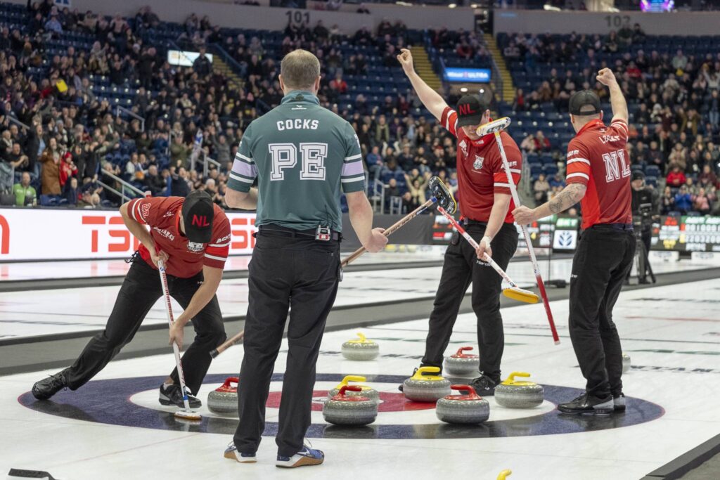 Newfoundland and Labrador's Team Nathan Young celebrate a tenth-end final-shot victory in a thrilling 9-8 win over Prince Edward Island's Team Tyler Smith Sunday at the 2026 Montana's Brier. (Photo, Curling Canada/Andrew Klaver)